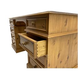 Waxed pine twin pedestal partners desk, fitted with eight drawers