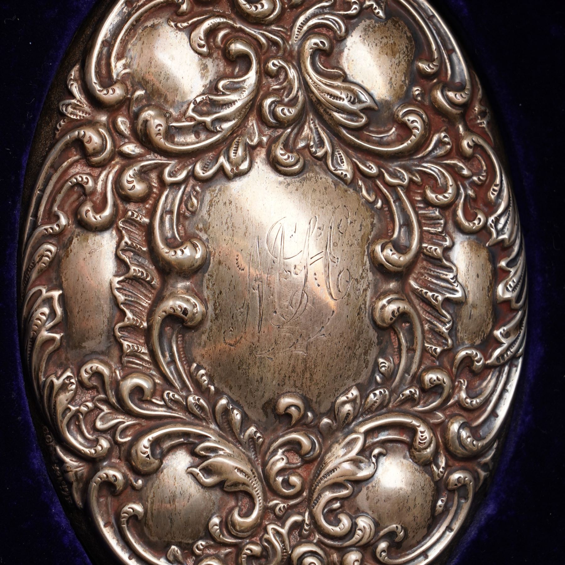 Victorian silver backed six piece dressing table set  with embossed decoration and engraved with initials in original case Chester 1900 Maker Charles Cooke