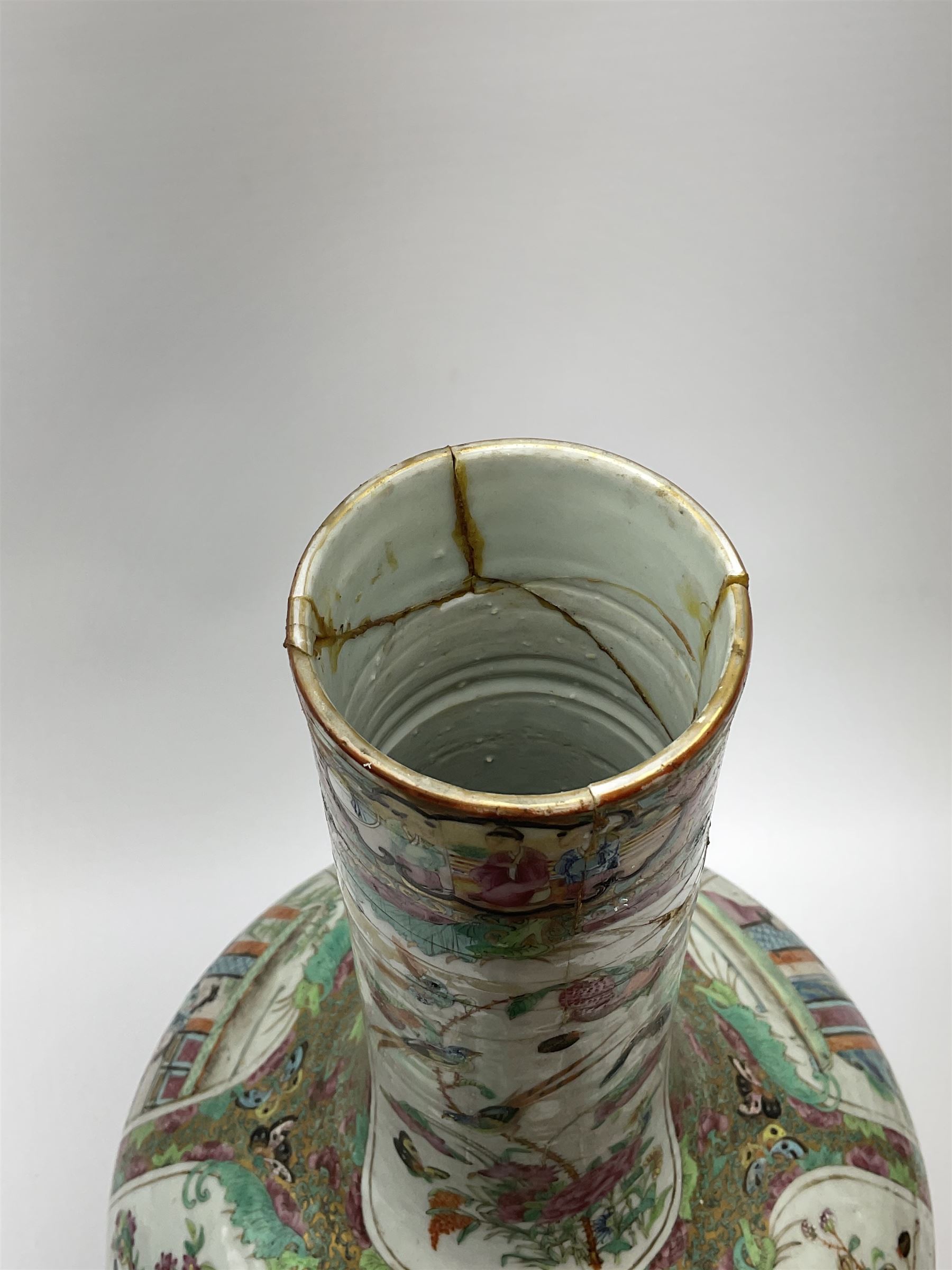 A 19th century Chinese Canton Famille Rose vase, of globular form with tall neck, and cover with finial, decorated with alternating panels of figural scenes, and birds and butterflies amongst blossoming and fruiting trees, with foliate surround against gilt, overall H57cm. 