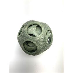 A carved Chinese soap stone puzzle ball with six concentric layers, H10.5cm. 