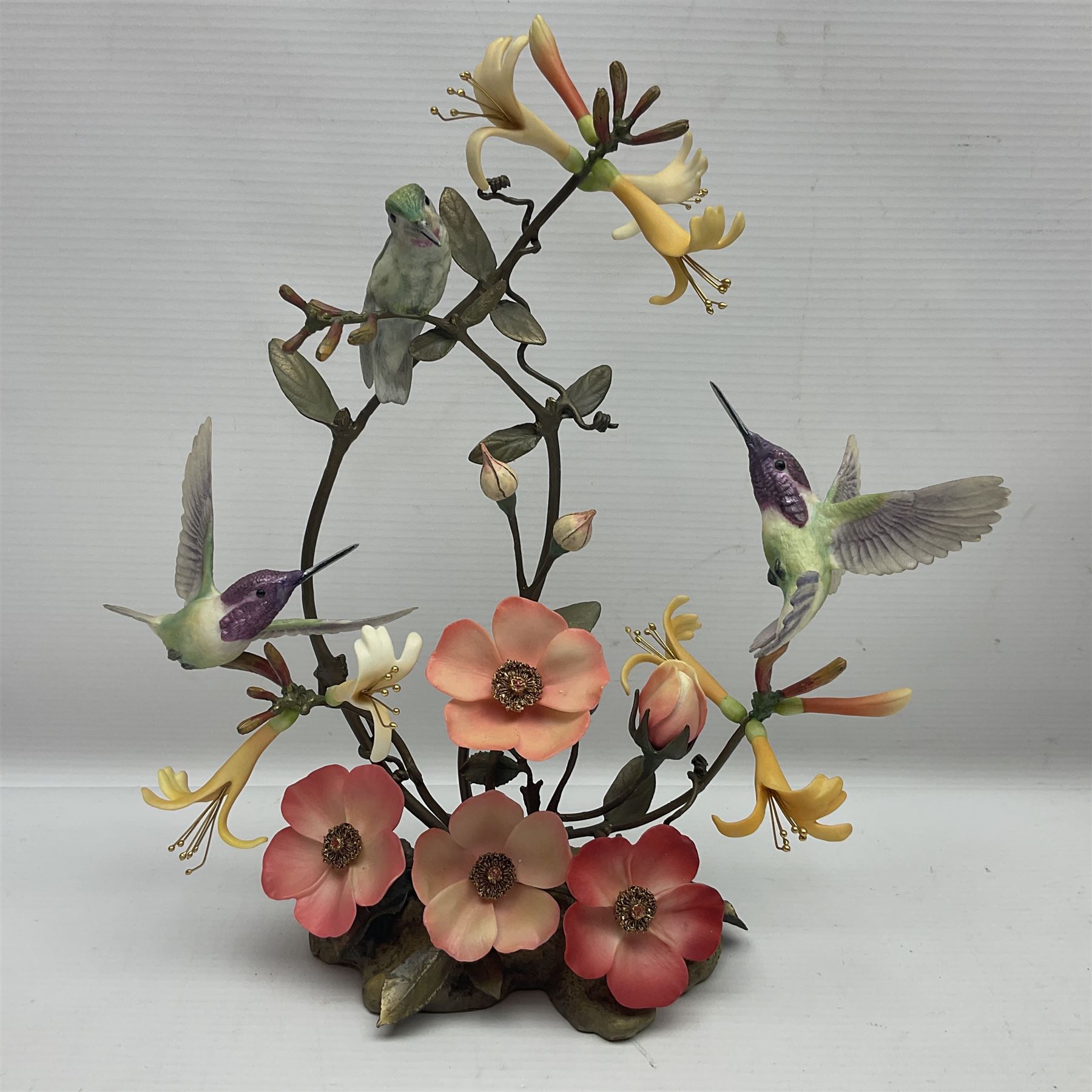 Franklin Mint House of Faberge, four humming bird figure groups, comprising Flight of Fancy, Beauty in Bloom, Splendor in the garden and The Enriched Garden, largest H35cm