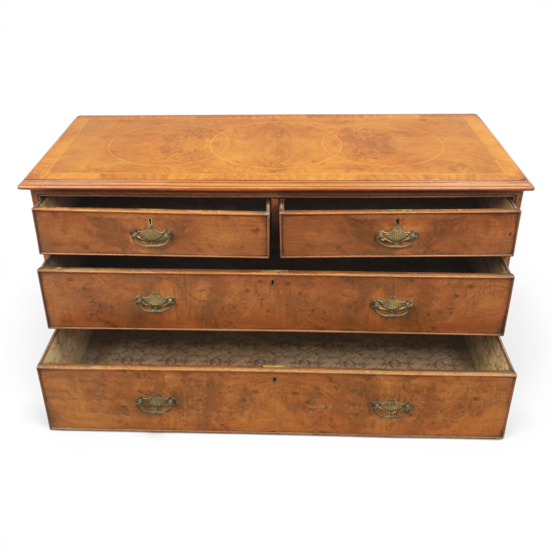 Traditional design walnut inlaid chest, with figured top with circular inlay and crossbanded top with moulded edge, figured drawers with cockbeaded edges and brass handles, raised on bracket feet