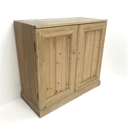 Early 20th century pine wine cabinet, two doors enclosing fitted sixty three bottle holder interior, plinth base, W92cm, H85cm, D40cm