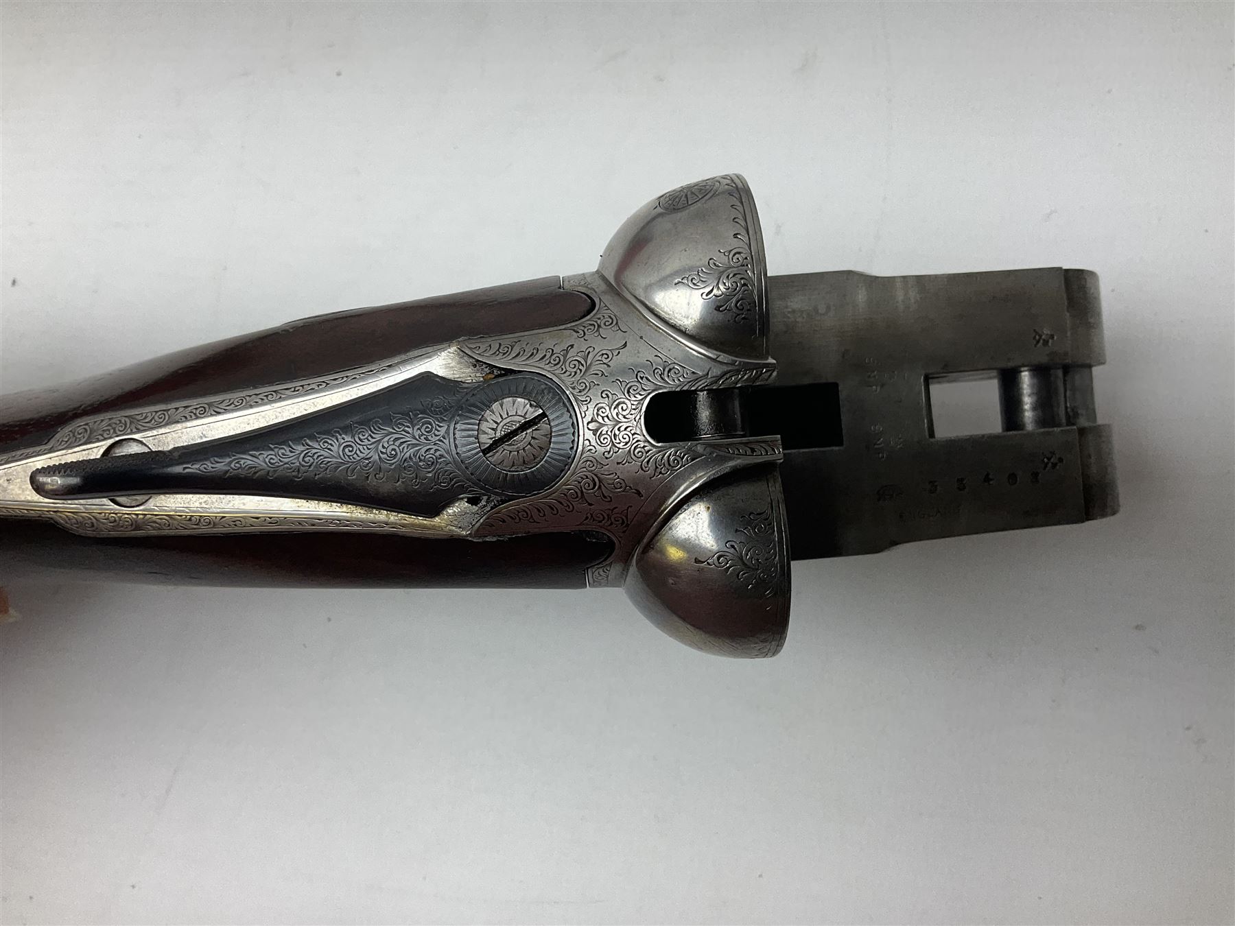 W.W. Greener 12-bore side-by-side double barrel non-ejector shotgun, with 76cm barrels, side safety, engraved lock, figured walnut stock with chequered grip and fore-end, no.33408, 120.5cm overall; in fitted canvas covered case with tools and accessories including .22 12-bore dog training device. SHOTGUN CERTIFICATE REQUIRED.