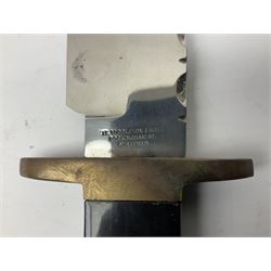 Large Bowie knife the 21cm steel blade marked J.E. Middleton & Sons Rockingham Street Sheffield with brass cross-piece and polished horn grip scales; in leather sheath L36cm overall