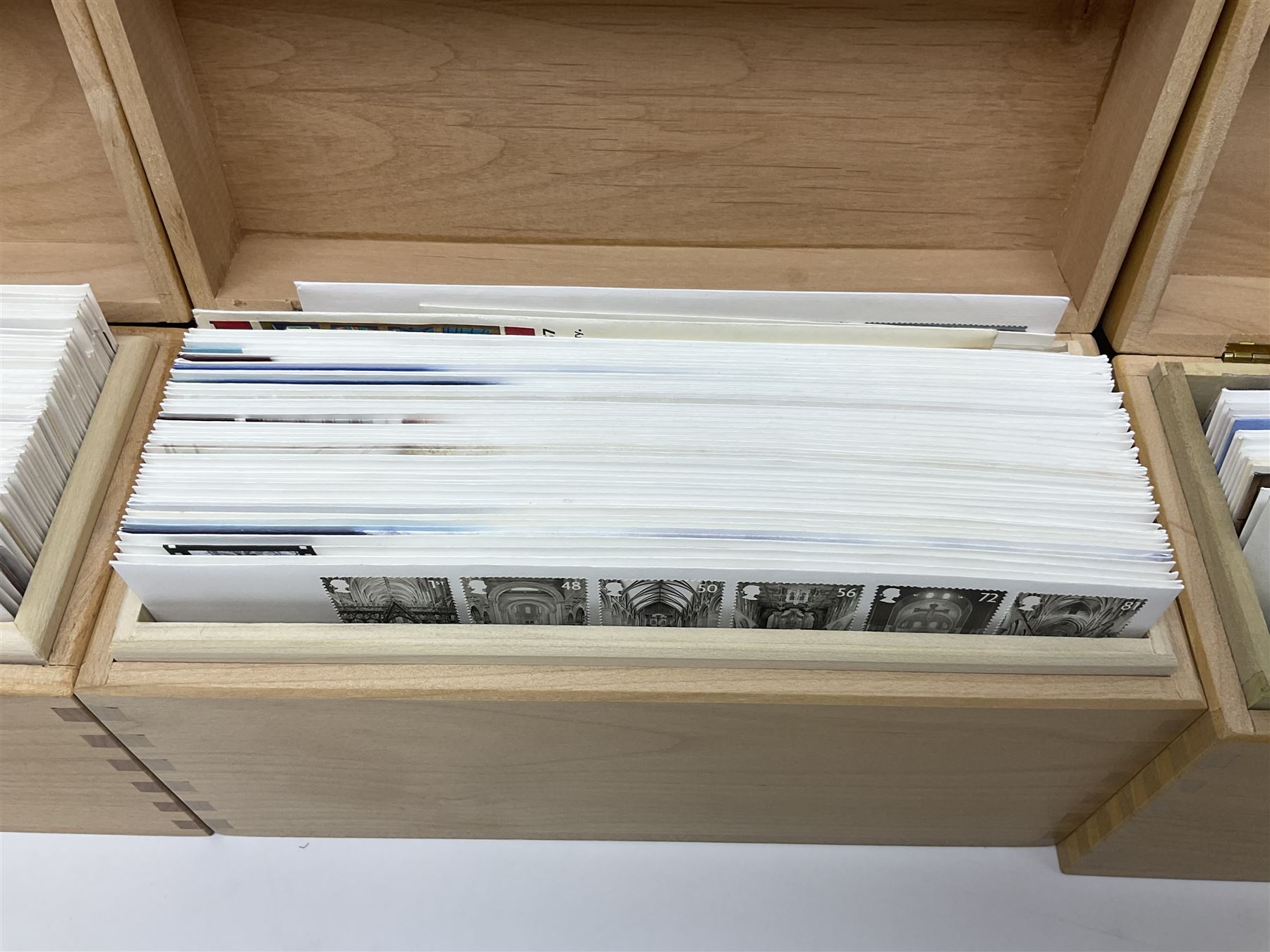 Coins and stamps, including The Royal Mint Great Britain 1970 coin set in plastic holder, 2006 'Brunel' coin cover containing two commemorative two pound coins, Alderney 2006 sterling silver proof five pounds, two 2007 five pound coins in card folders, two limited edition mint first class stamp sheets each comprised of ten first class stamps, various first day covers many with special postmarks housed in 'Royal Mail' boxes etc