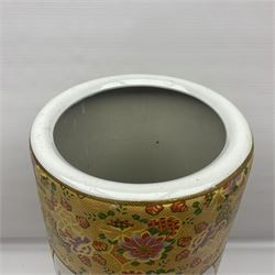 Modern Japanese ceramic umbrella stand, decorated with a figural panel on a yellow floral ground, H60cm