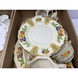 Minton Marlow pattern tea and dinner wares, including dinner plates, side plates, tea cups, cake plate, etc together with Bishops & Stonier 'Bisto' green and gilt tea wares and Maddock Ivory Ware dinner wares, in three boxes