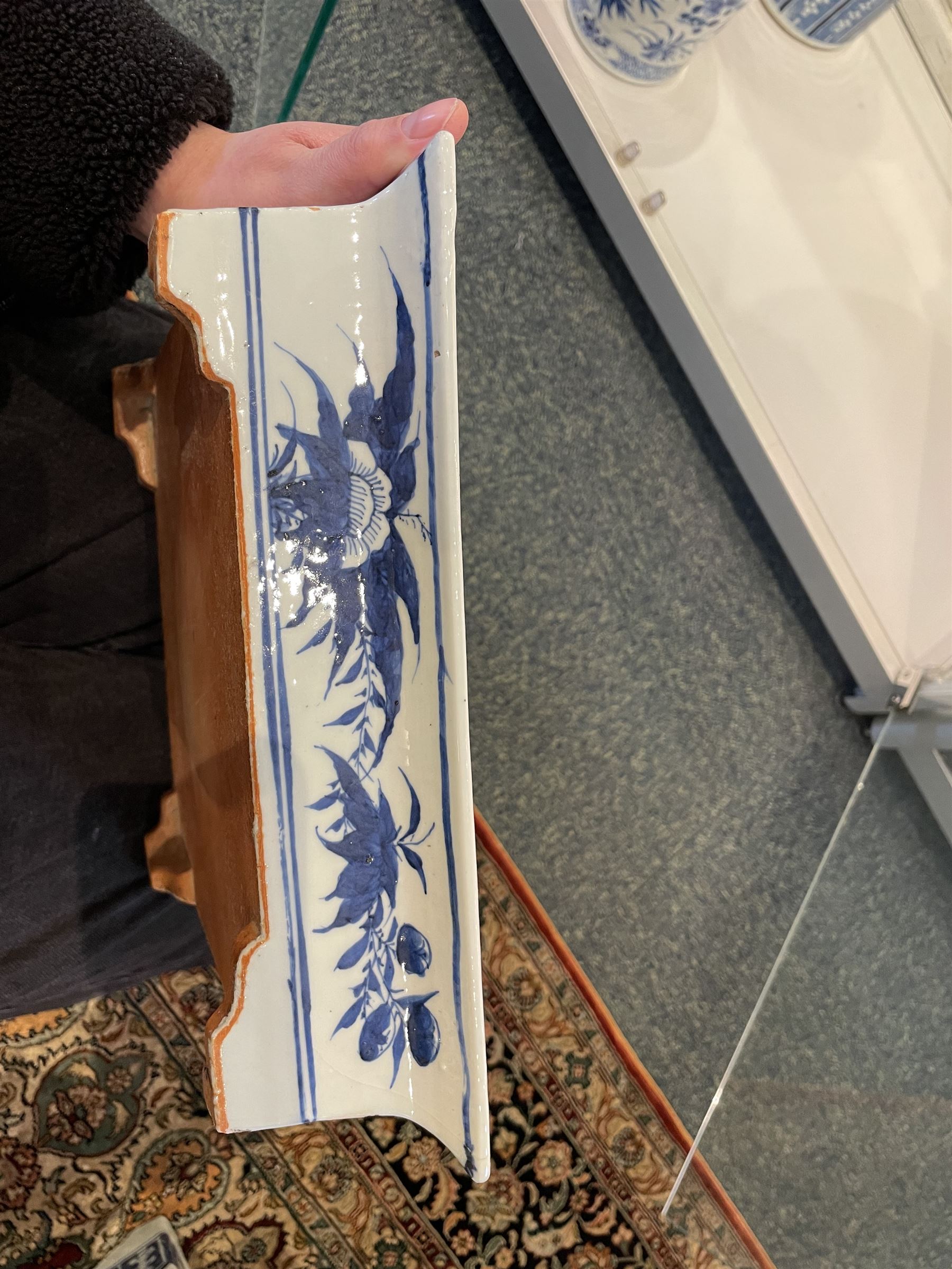 Chinese blue and white planter and stand, each of square slightly tapering and flared form, the planter decorated with two dragons and blossoming peonies, between stylised borders, the stand decorated with flower heads and vines, planter H30cm W29cm, stand H7cm D28.5cm