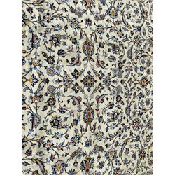 Persian pale jade ground carpet, the field decorated with all-over interlaced foliate branches and scrolling flower heads, the multi-band border with repeating palmette motifs