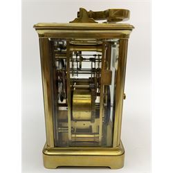 Early to mid 20th century French brass and bevelled glass cased carriage clock, the shaped loop handle over oval glass panel, white enamel Roman dial, twin train driven eight day movement striking on coil, with button push repeater, the movement back plate stamped for 'R & Co.'