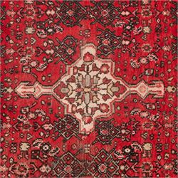 Persian crimson ground runner rug, the field decorated with repeating Herati motifs around an ivory pendant medallion, stepped ivory spandrels with stylised floral ornament, enclosed by a dark ground star border and narrow guard stripes