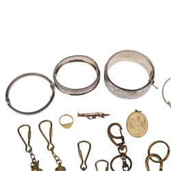 9ct gold jewellery, including bone deer pendant in gold mount, signet ring and stone set brooch, all stamped or hallmarked, three silver bangles, base metal bangle, brass diving related keychains and a Tag Heuer quartz wristwatch