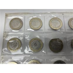 Queen Elizabeth II United Kingdom fifty mostly commemorative two pound coins, housed in two plastic sleeves 