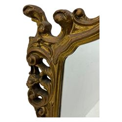 Victorian design gilt framed overmantel mirror, the arched and moulded frame adorned with scrolling foliate motifs and acanthus leaves, surmounted by a pierced cartouche, plain mirror plate, resting on a shaped base