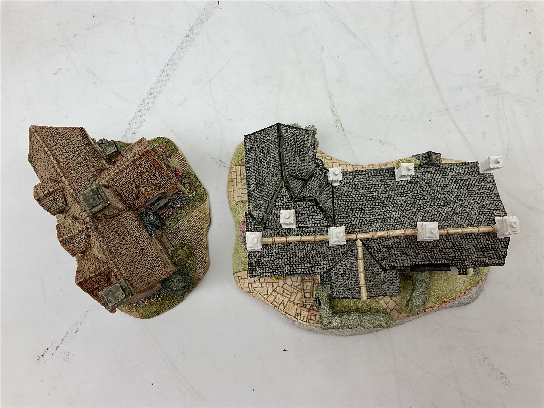 Four Lilliput Lane models from the 'Britain's Heritage' collection, comprising Edinburgh Castle, The World Famous Blacksmith's Shop Gretna Green, Shakespeare's Birthplace and Mickelgate Bar York, together with  a Lilliput Lane Beatrix Potter Hill Top model, all boxed