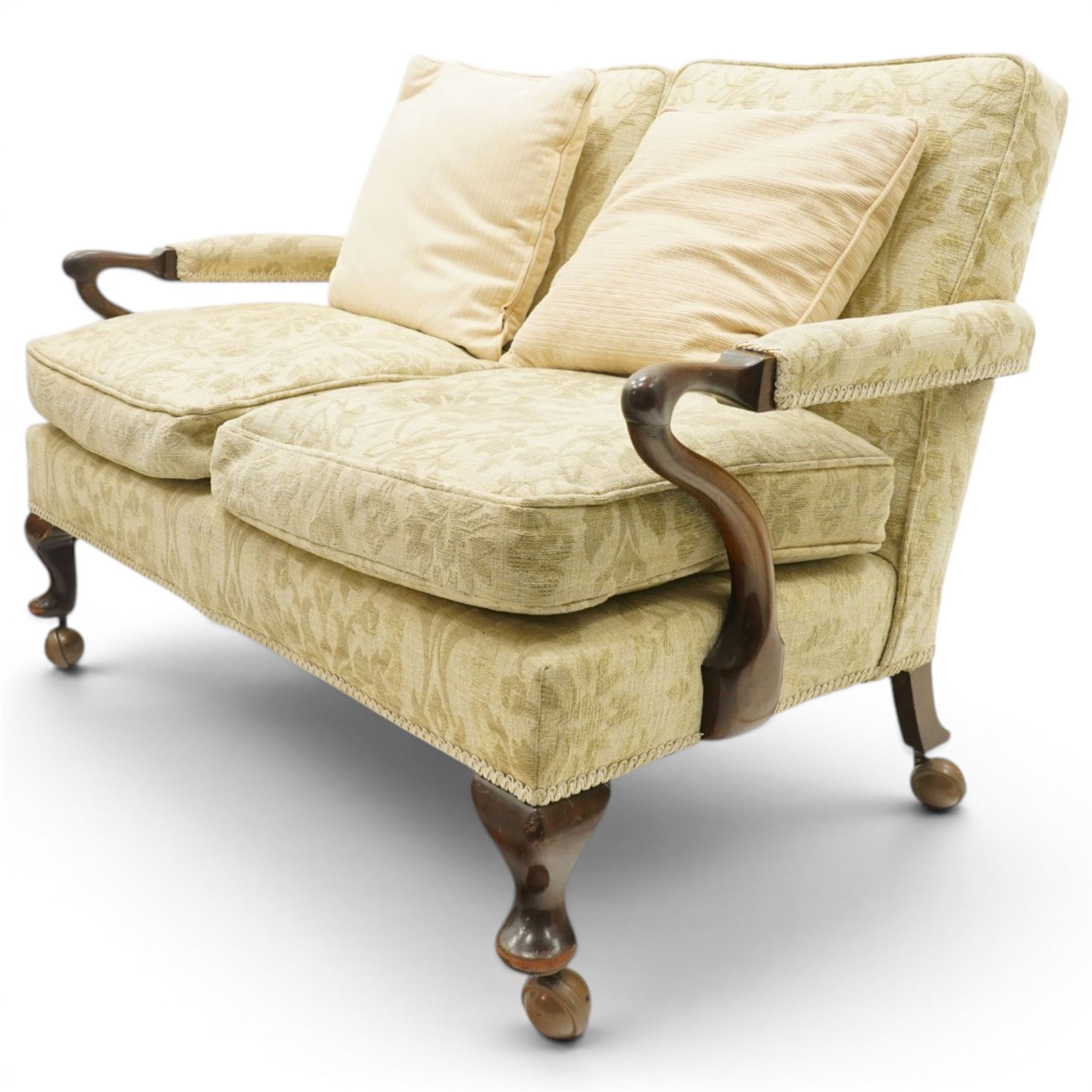 George II design mahogany framed three-piece salon suite, comprising settee and two armchairs, with pale green floral patterned upholstery, scroll carved arm terminals, loose cushioned seats and backs, raised on cabriole supports terminating in castors
Armchairs (H 80cm, W 62cm, D 73cm)