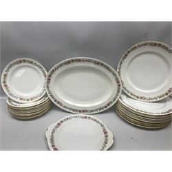 Royal Albert Paragon tea and dinner service for twelve decorated in the Belinda pattern, comprising fourteen saucers, twelve teacups, thirteen side plates, teapot, sauce boat and stand, salt and pepper shakers, two jugs, sucrier, twelve dinner plates, twelve smaller plates, two lidded tureens, twelve bowls, twelve smaller bowls, cake plate, oval plate and oval dish (100)