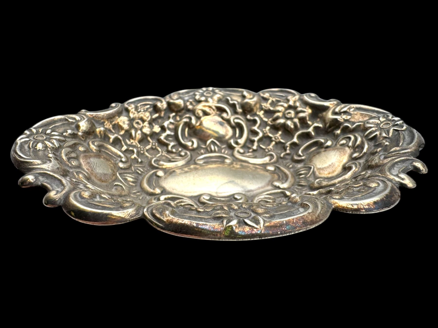 Two silver bon bon dishes, comprising Edwardian example and a modern example, both with embossed decoration, both hallmarked, together with an American silver cover, stamped Sterling