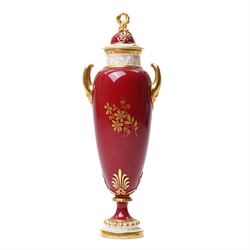 Early 20th century Royal Worcester vase and cover by Harry Davis, painted with a distant view of a castle and a couple resting on a red ground, heightened profusely with gilt, shape number 2422, printed marks in green to base, H25cm
