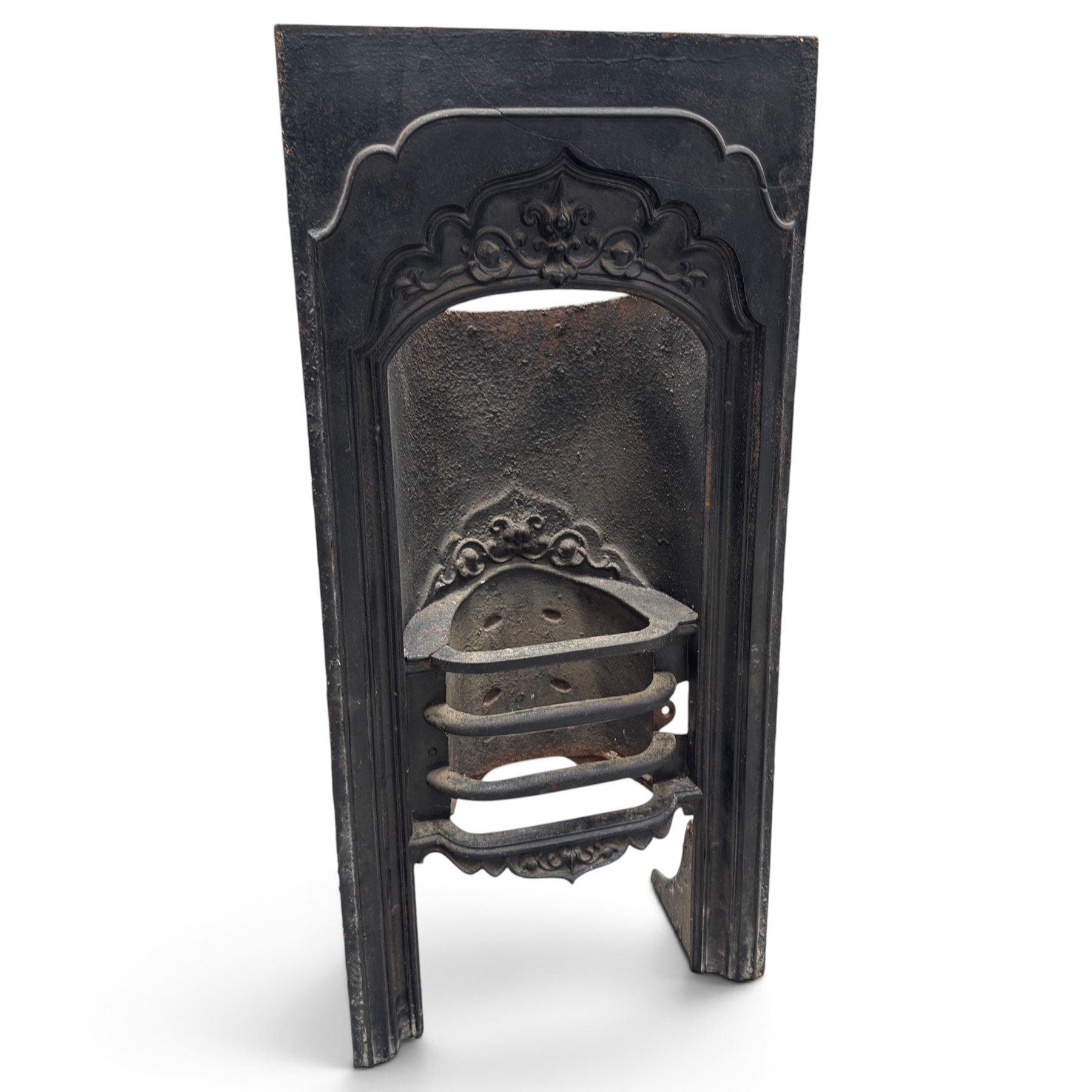 Three cast iron fireplace fittings, comprising a Regency-style fire grate with sunburst crest, urn finials, bowed basket and scroll supports (W58cm H63cm); Victorian fender with pierced acanthus frieze and foliate base (W64cm H20cm); Gothic Revival fireplace with fleur-de-lis crest, arched surround and integral fire basket (W41cm H87cm)