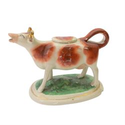 Collection of 19th century and later cow creamers, including three black glaze examples, two mottled brown examples etc  