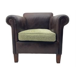 Leather tub shaped chair with fabric cushion