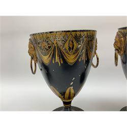 Pair of Georgian tole chestnut urns and covers, with lion mask handles, decorated with gilt detail, the sharply upswept cover topped with acorn finials, H31cm