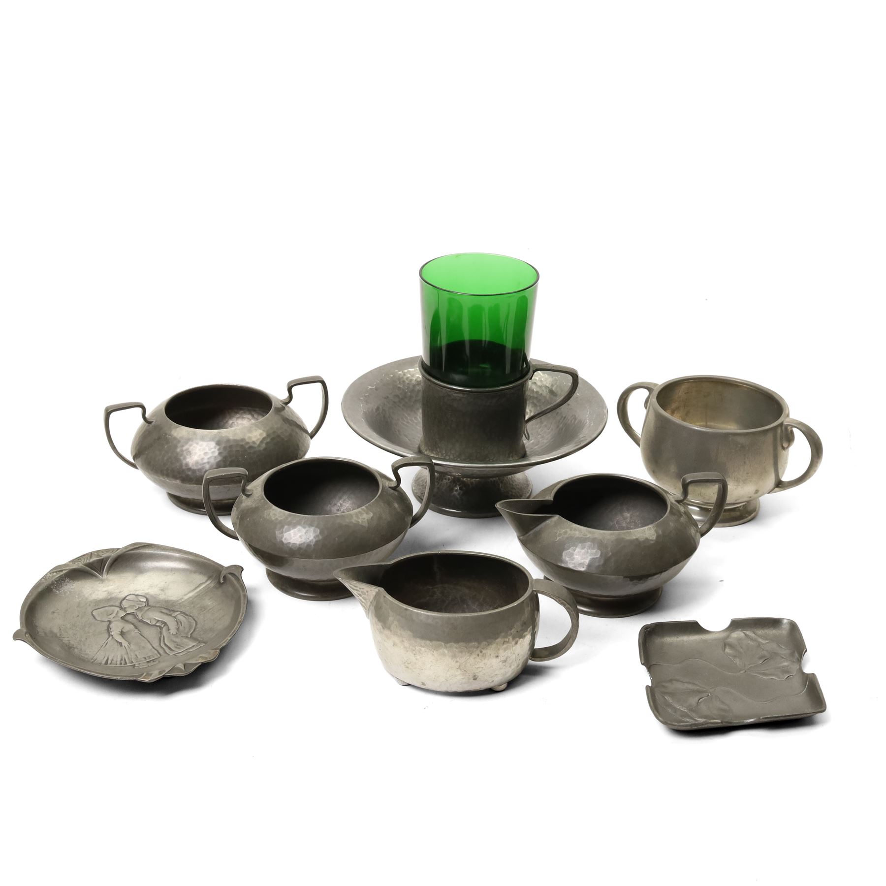 Quantity of Tudric pewter including small hammered pedestal bowl, milk jugs, sugar bowls etc and a WMF dish with Dutch figures No261