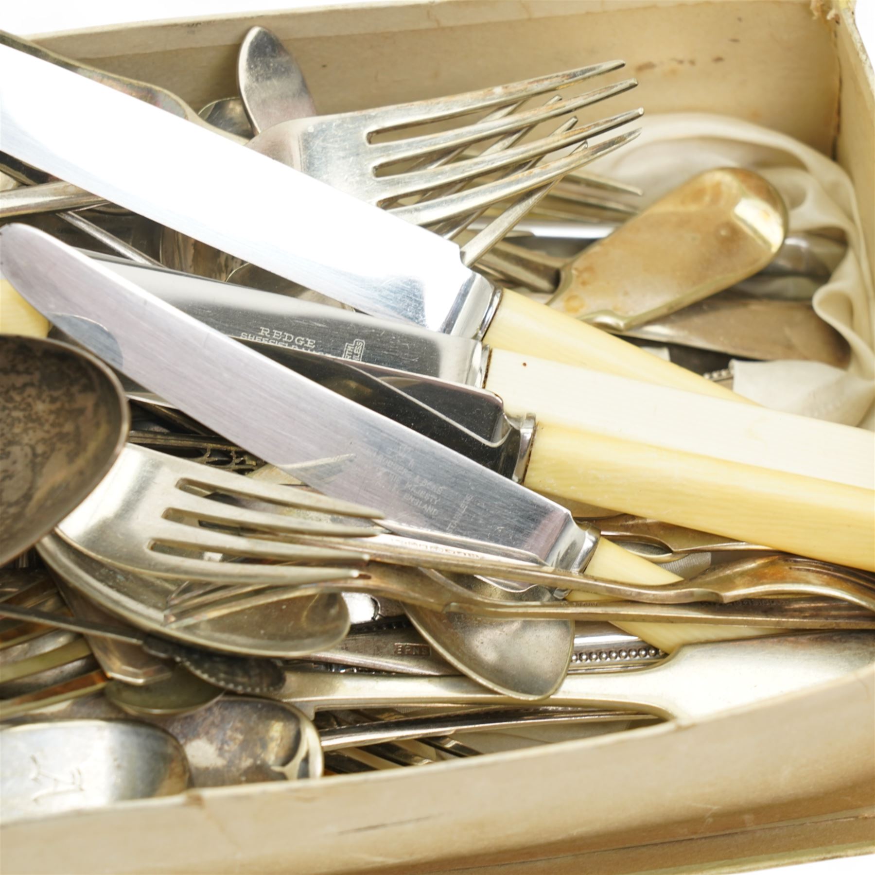 Quantity of plated cutlery, pair of silver sugar tongs, Georgian silver spoon etc