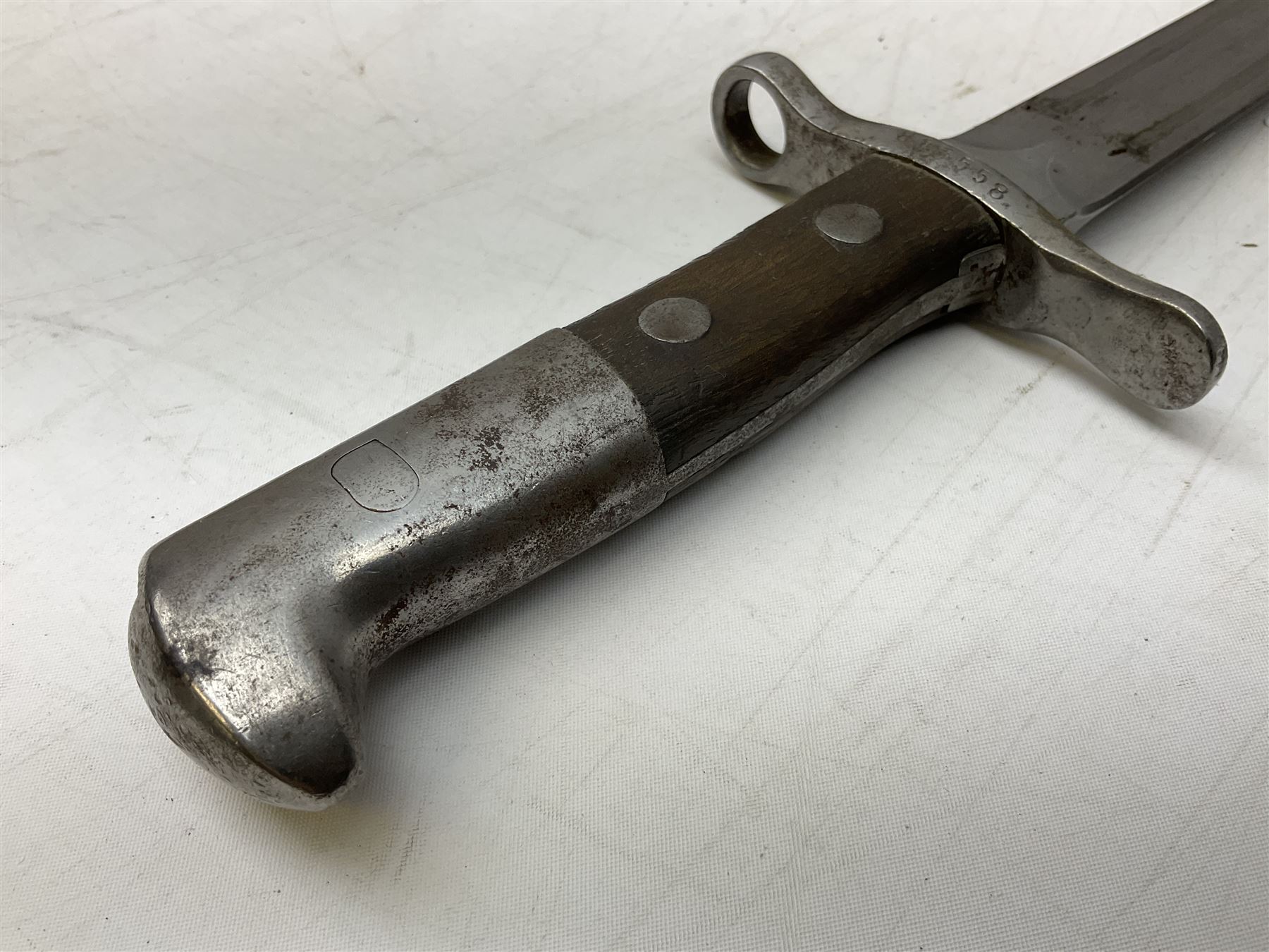 Schmidt-Rubin Model 1918 bayonet, the 30cm steel blade marked Elsener Schwyz, cross-piece numbered 813558; in steel scabbard with leather frog stamped E. Banga Sattler Selzac 67 L45.5cm overall; and Swiss Model 1957 SIG rifle bayonet by Wenger; in plastic scabbard with leather frog stamped E. Walty Sattlerei Baretswil 84 (2)