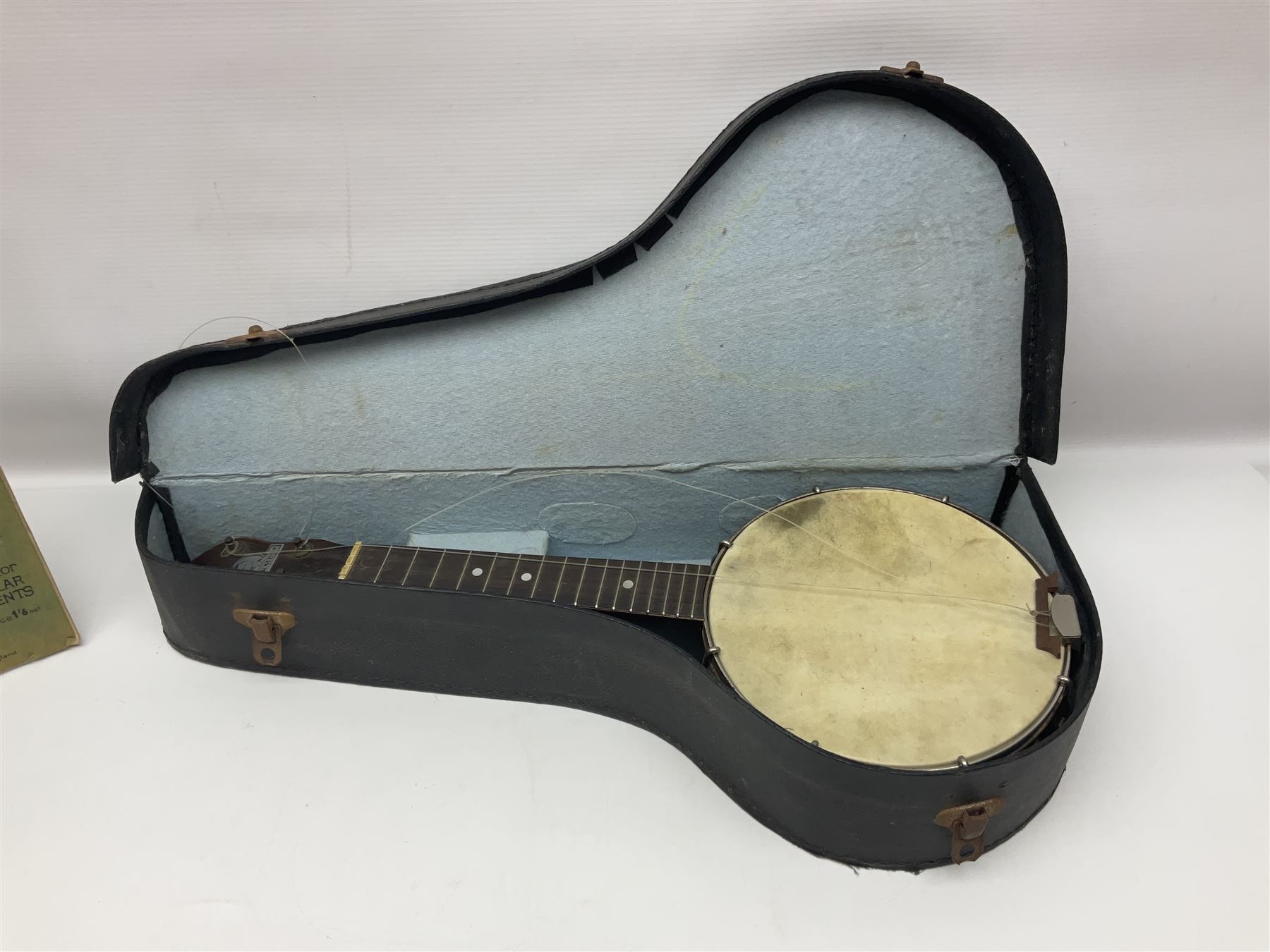 George Formby banjolele with metal plaque to headstock L55cm; in carrying case with instruction booklet.