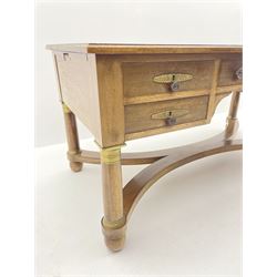 French Empire style walnut desk, moulded rectangular top with inset leather, two leather inset slides either side, fitted with four drawers, turned supports joined by curved x-shaped stretchers, gilt metal mounts 