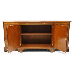 Georgian design figured and burr walnut breakfront sideboard, shaped rectangular top inlaid with crossbanding and stringing, fitted with central brushing slide over cupboard enclosing single adjustable shelf, flanked four graduating cock-beaded drawers to each side, raised on bracket feet
