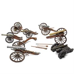 Six scale wood and metal models of cannons, length of longest 32cm together with a gun car...