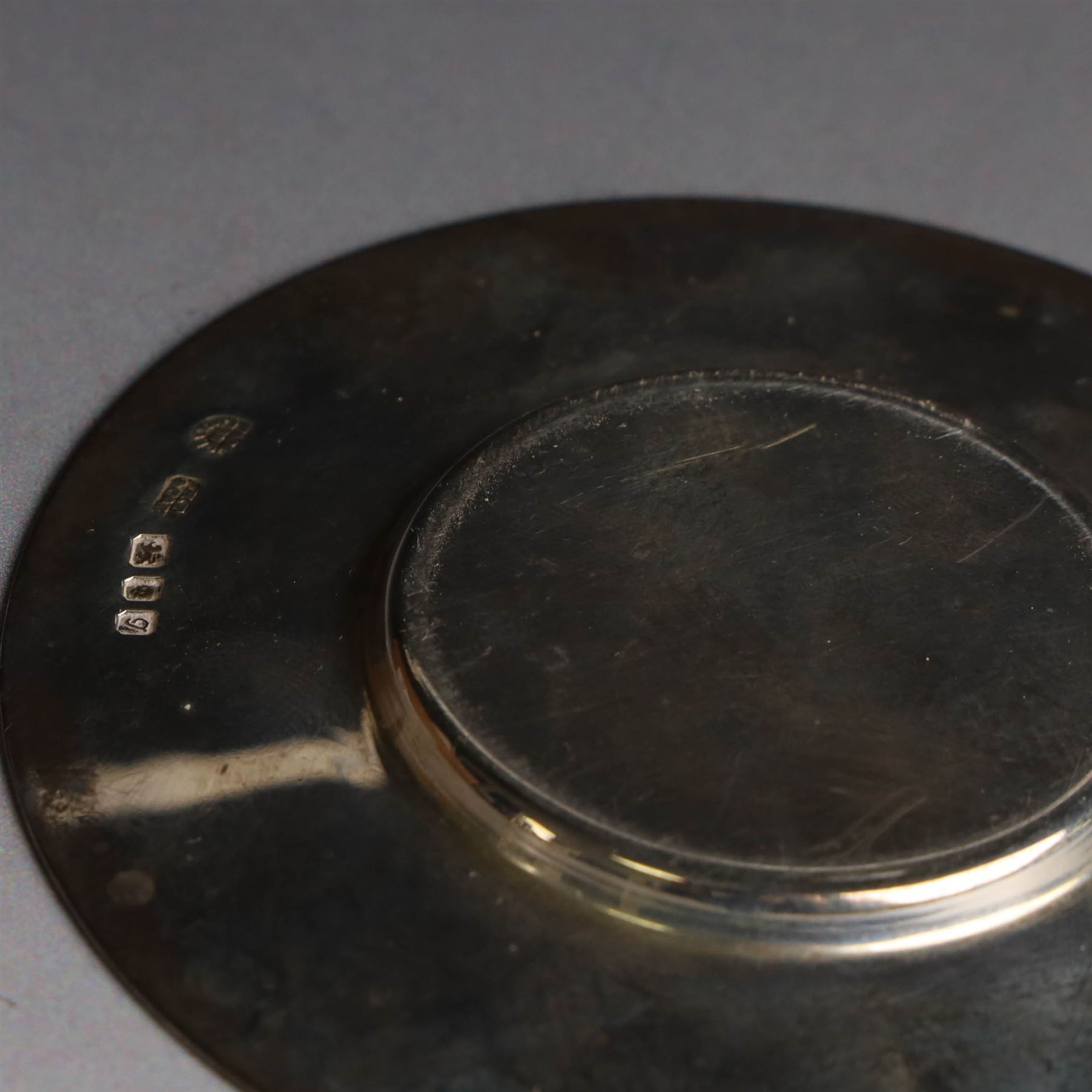 Mid 20th century silver travelling communion set, comprising goblet, paten and pyx, all hallmarked Hurst, Franklin & Co Ltd, London 1961 & 1962, with a glass bottle with unmarked cover, all within a tooled leather fitted case, goblet H9cm