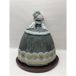 Large Lladro figure, La Menina, modelled as a maid of honor in service, on a mahogany oval base, limited edition 99/1000, sculpted by Jose Puche, with certificate of authenticity, framed and glazed, no 1812, year issued 1996, year retired 2019, H60cm
