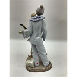 Lladro figure, Minstrel's Love, modelled as a couple entertaining, the lady in ballerina costume playing the lute and the gent stood behind her in jester type dress, sculpted by Rafael Lozano, with original box, no 5821, year issued 1991, year retired 1993, H31cm