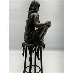  Art Deco style bronze modelled as a female figure, holding her knee, seated upon a chair, after 'Pierre Collinet', H28cm