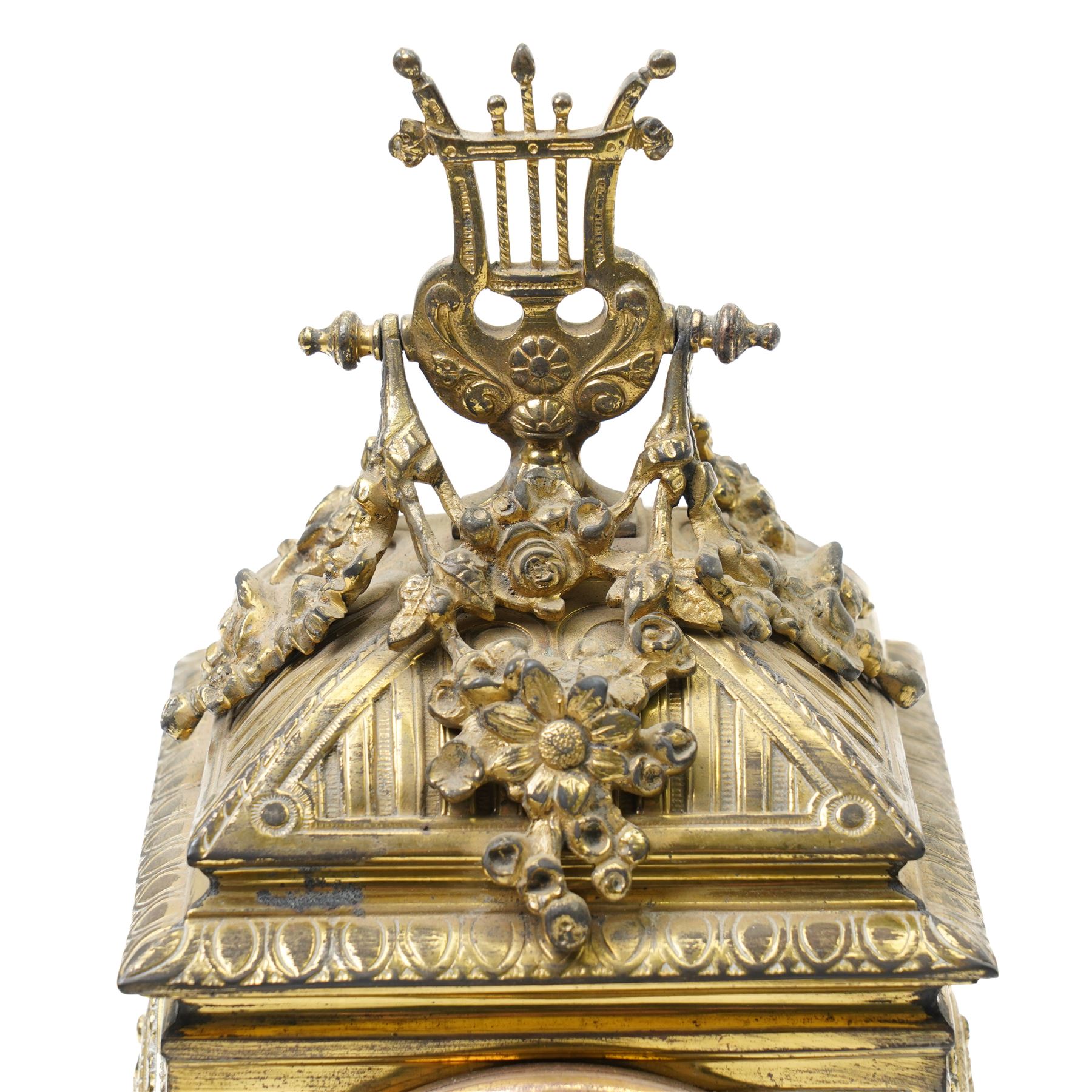 Early 20th century mantel clock with white enamel dial, French timepiece movement and recoil anchor escapement in brass case with lyre finial, trailing garlands and wreaths etc on scroll feet H30cm 
Provenance: property of a Nobleman