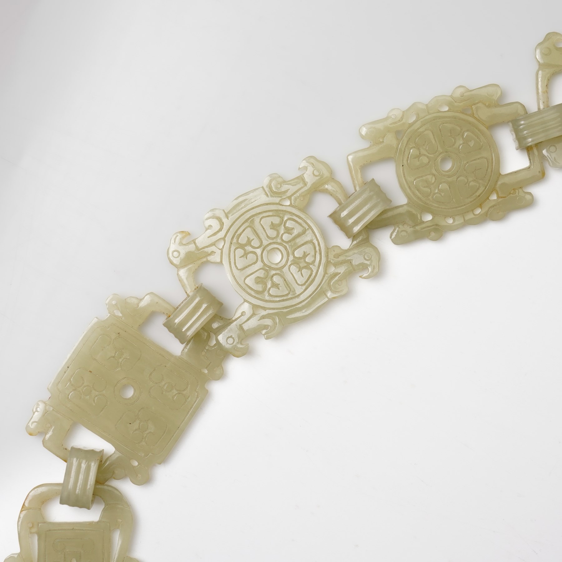 Chinese carved greenstone belt, each link carved with symbols, W108cm 