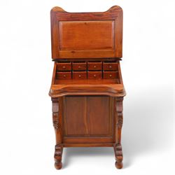 Victorian design mahogany Davenport desk, the sloped writing surface inset with tooled green leather and hinged to reveal a fitted interior, with a pen compartment to the raised gallery back, four drawers to each side, on carved scrolled supports with acanthus detail, raised on turned feet