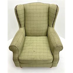 Next Sherlock wingback armchair upholstered in a light green chequered fabric, turned supports 