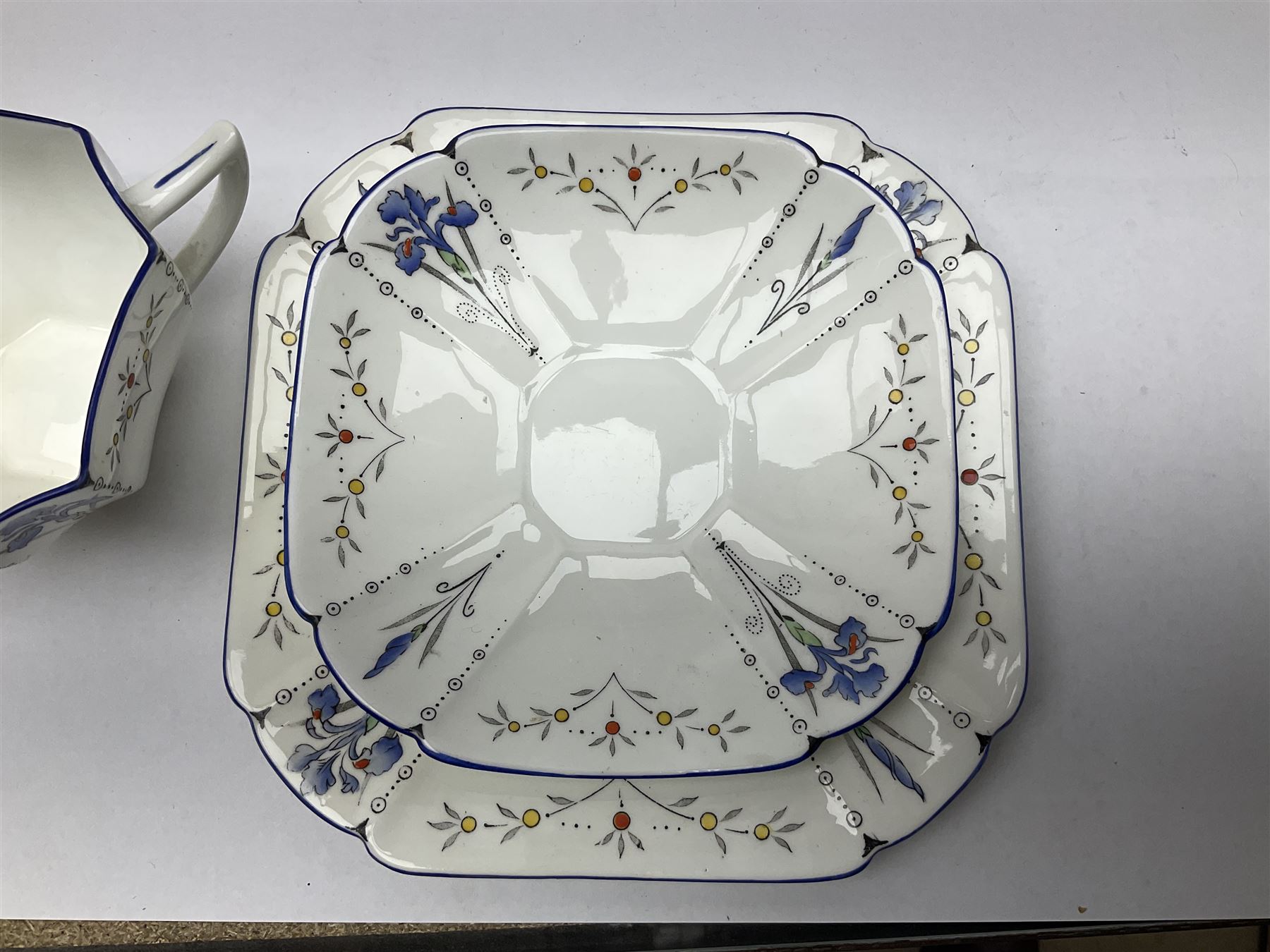 1920s Shelley Queen Anne shaped trio, decorated in the Blue Iris pattern no. 11561, ith printed mark beneath 