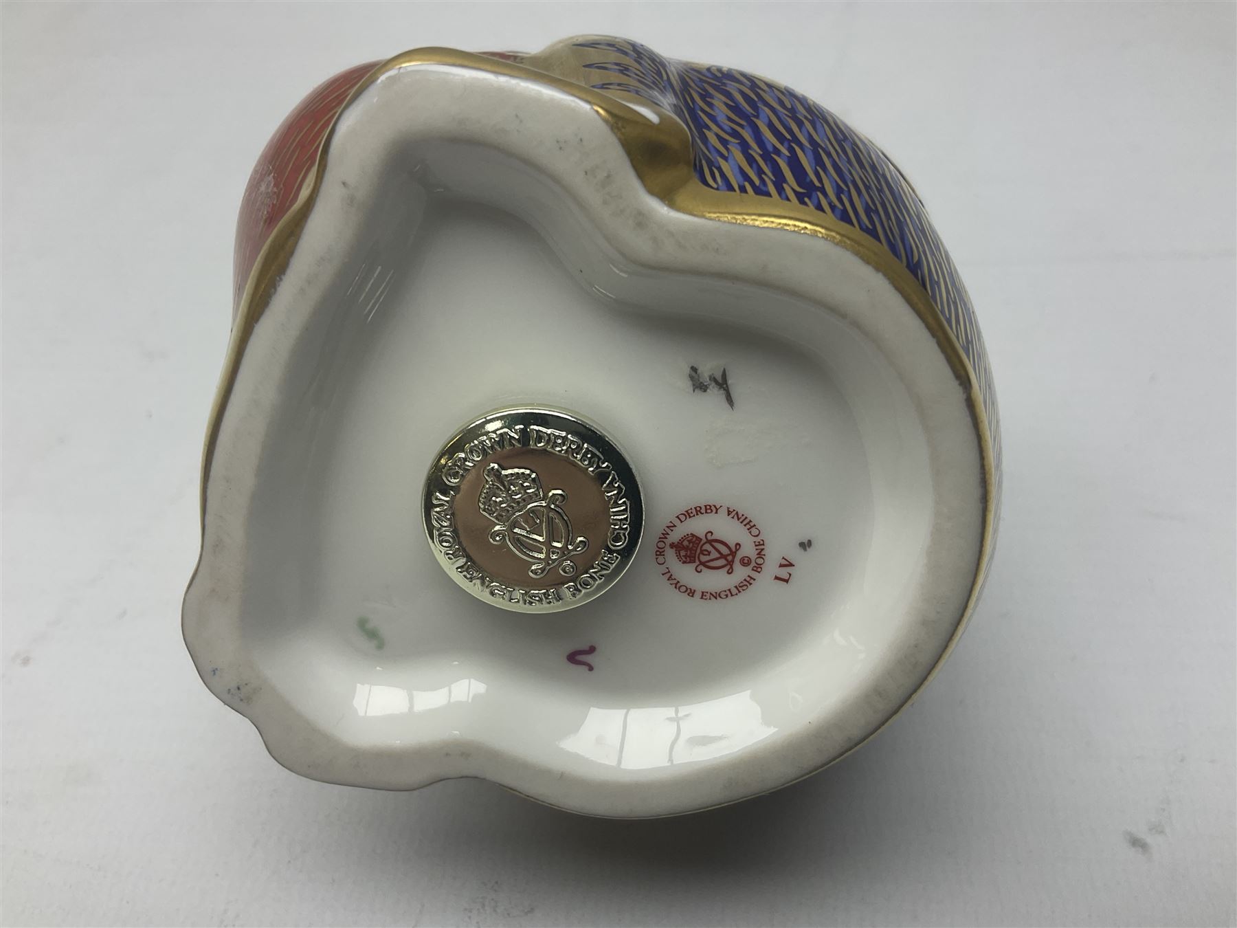 Three Royal Crown Derby paperweights, comprising Macaque, with gold stopper and original box, Monkey and Baby, with silver stopper and original box and Dragon with silver stopper, all with printed mark beneath  