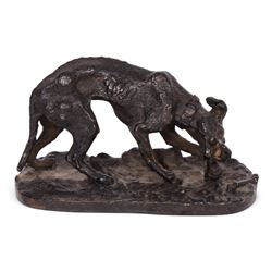 After R J Mene, bronze modelled as a dog with a bone, H5cm, L10cm 