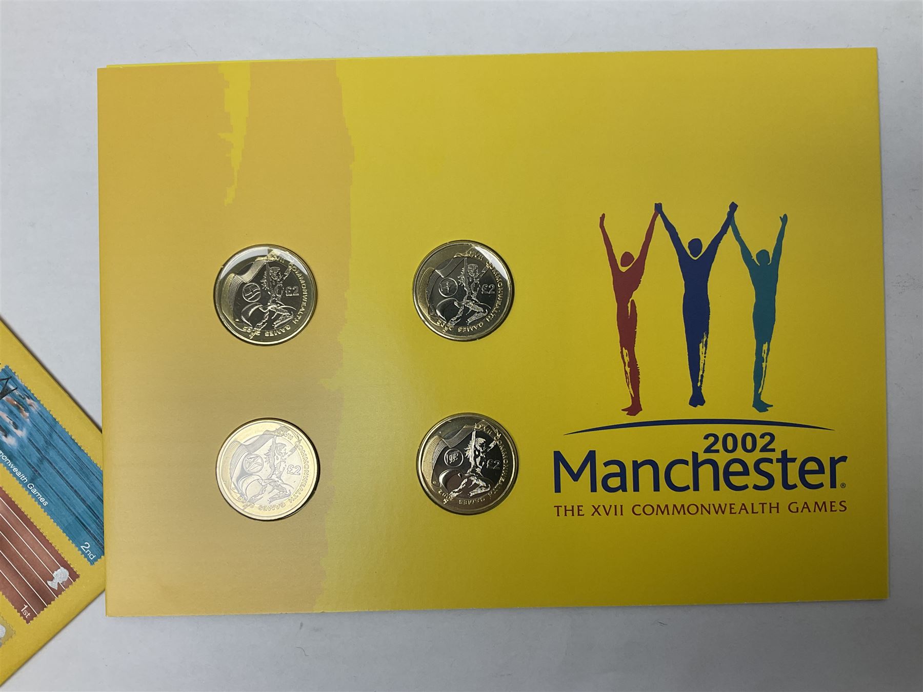 The Royal Mint Queen Elizabeth II 2002 Manchester Commonwealth Games four coin two pound coin cover