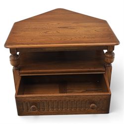 Ercol -  dark elm corner TV stand and coffee table, TV stand with drop triangular leaf, over open recess above a single drawer (H 47cm, D 44cm with leaf 79cm, W 73cm,  the coffee table with chamfered rectangular top with full length undertier, raised on turned supports (H 43cm, D 54cm, W 115cm) 
