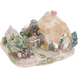 Eight Lilliput Lane models, comprising Heritage Collection Buckingham Palace, Crown Inn, Anne Hathaway, Periwinkle Cottage, Royal Oak Inn, Through The Keyhole, Burley Street Garage and The George Inn