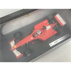 Five Mattel Hot Wheels 1:18 scale die-cast racing cars - Ferrari F1-2000 Michael Schumacher; Ferrari F-2002 Michael Schumacher; Jordan E-110 Heinz-Harald Frentzen; Williams F1 Team FW23Juan Pablo Montoya; and Ferrari F2001 Rubens Barrichello; all boxed (5)